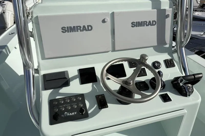 Slide: The Image of 2024 Stuart 27 boat helm with Simrad electronics. - 9