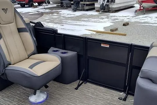 Slide: The Image of Interior of a 2026 Viaggio x22u with beige seat and cup holders. - 17