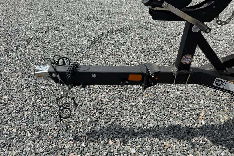 Slide: The Image of Trailer hitch of a 2022 Tahoe 2150 on gravel surface. - 16