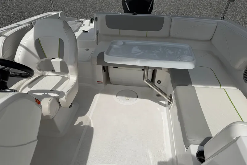 Slide: The Image of 2022 Tahoe 2150 boat interior with seating and table, featuring modern design and comfort. - 18