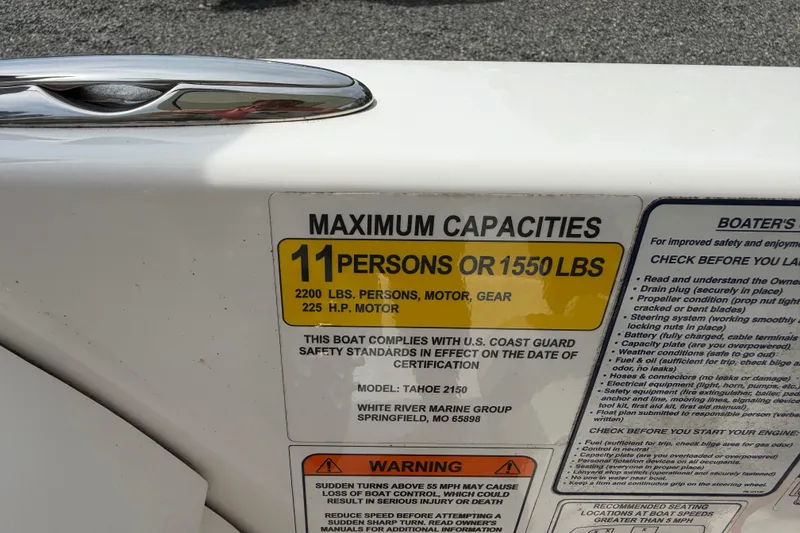 Slide: The Image of Capacity label on 2022 Tahoe 2150 boat, max 11 persons or 1550 lbs. - 26