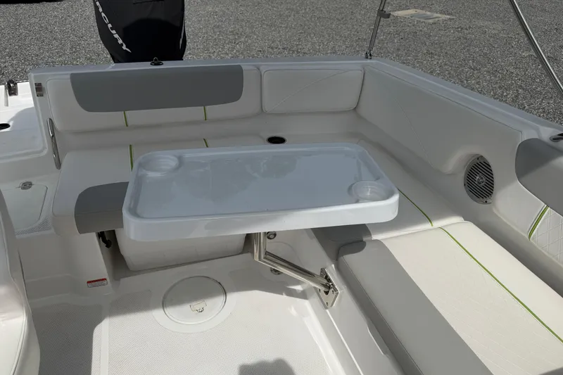 Slide: The Image of 2022 Tahoe 2150 boat interior with seating and table setup. - 29