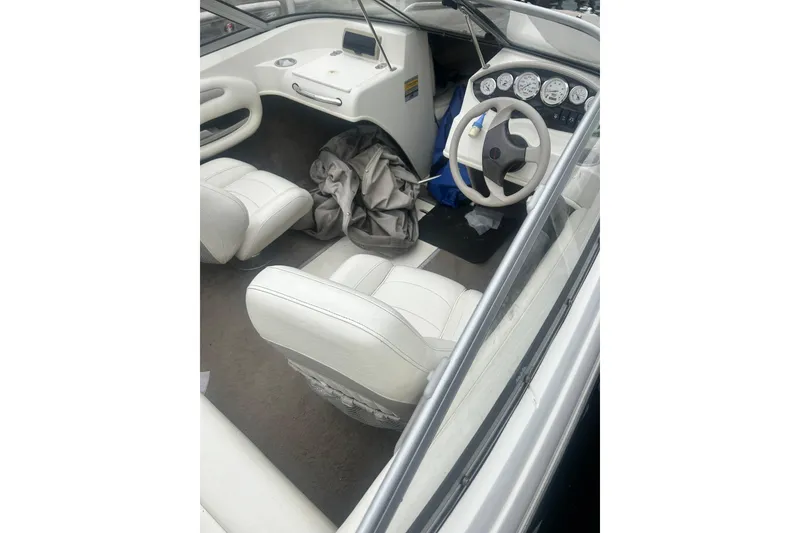 Slide: The Image of Interior of a 2005 Stingray 185 LS/LX boat with white seats. - 8