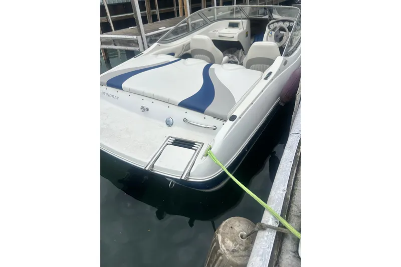 Slide: The Image of 2005 Stingray 185 LS/LX boat docked at marina. - 9