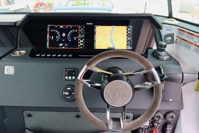 Slide: The Image of Steering wheel and dashboard of 2022 Axopar 37 XC Cross Cabin boat. - 11