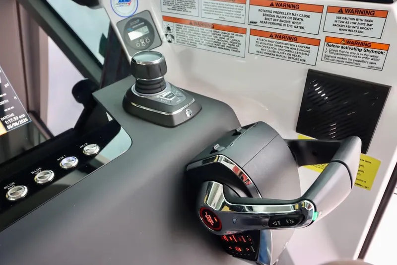 Slide: The Image of Control panel of 2022 Axopar 37 XC Cross Cabin with joystick and steering wheel. - 12