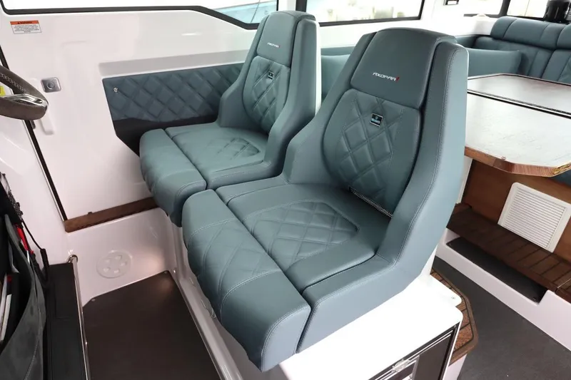 Slide: The Image of Luxurious seating in 2022 Axopar 37 XC Cross Cabin with quilted upholstery and modern design. - 15