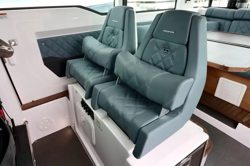 Slide: The Image of 2022 Axopar 37 XC Cross Cabin interior with luxurious seating and modern design. - 16