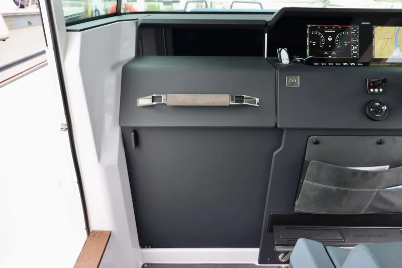 Slide: The Image of Interior view of 2022 Axopar 37 XC Cross Cabin dashboard and controls. - 24