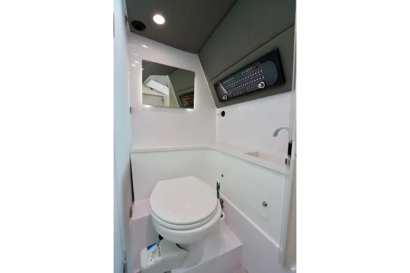 Slide: The Image of 2022 Axopar 37 XC Cross Cabin bathroom with modern fixtures and sleek design. - 27