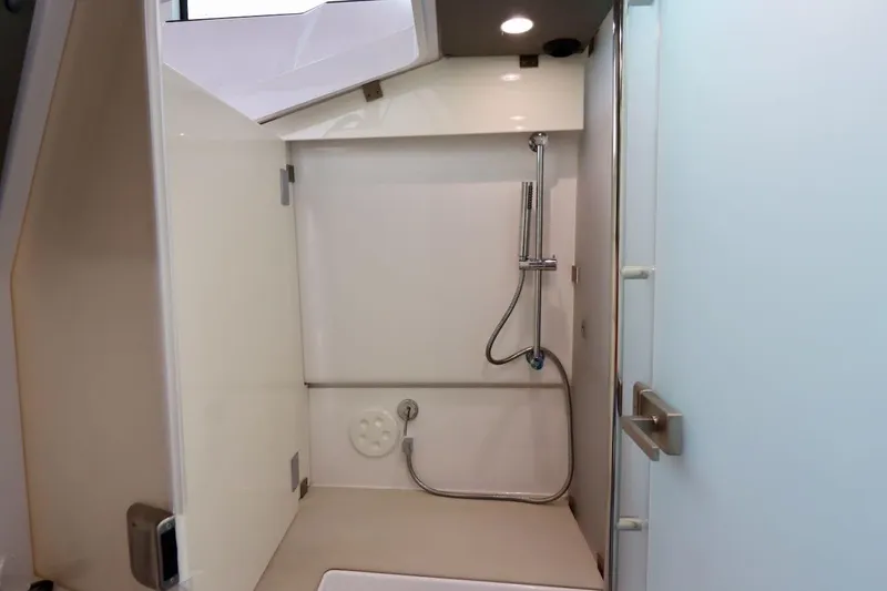 Slide: The Image of 2022 Axopar 37 XC Cross Cabin bathroom with modern shower design. - 29