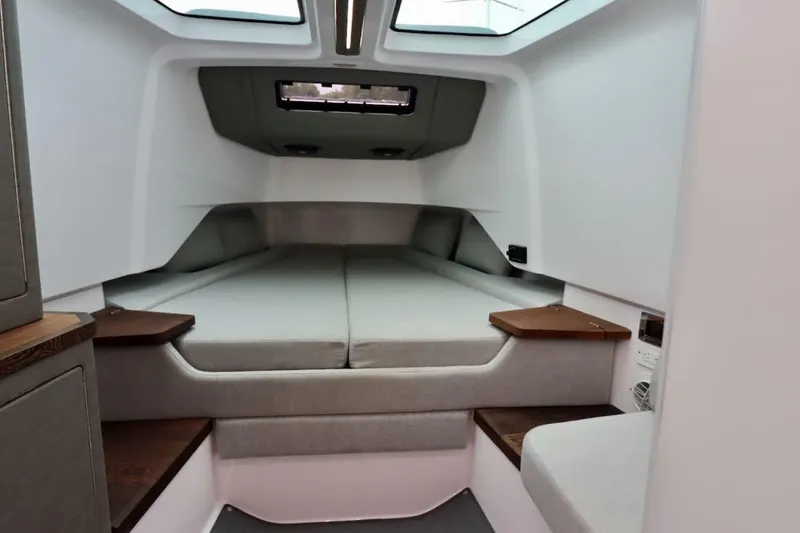 Slide: The Image of 2022 Axopar 37 XC Cross Cabin interior with cozy sleeping area and modern design. - 30