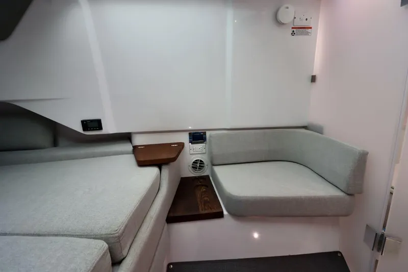 Slide: The Image of Interior of 2022 Axopar 37 XC Cross Cabin with modern seating and sleek design. - 31