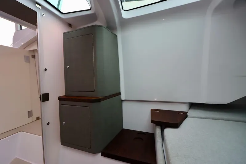 Slide: The Image of Interior of 2022 Axopar 37 XC Cross Cabin, featuring sleek cabinetry and modern design elements. - 32