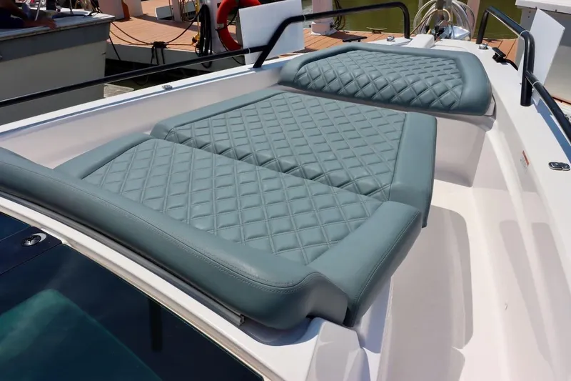 Slide: The Image of Luxurious seating on 2022 Axopar 37 XC Cross Cabin boat, featuring quilted upholstery. - 34