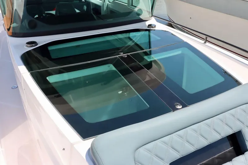 Slide: The Image of 2022 Axopar 37 XC Cross Cabin with sleek glass roof panels. - 38
