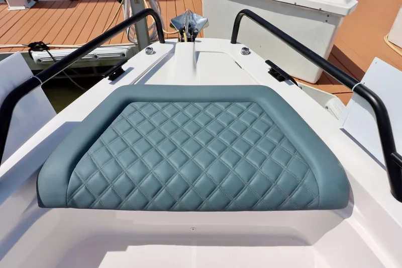 Slide: The Image of 2022 Axopar 37 XC Cross Cabin with quilted seating detail on deck. - 39