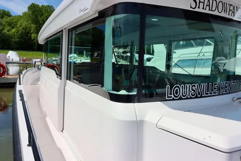 Slide: The Image of 2022 Axopar 37 XC Cross Cabin boat docked in Louisville, Kentucky marina. - 43