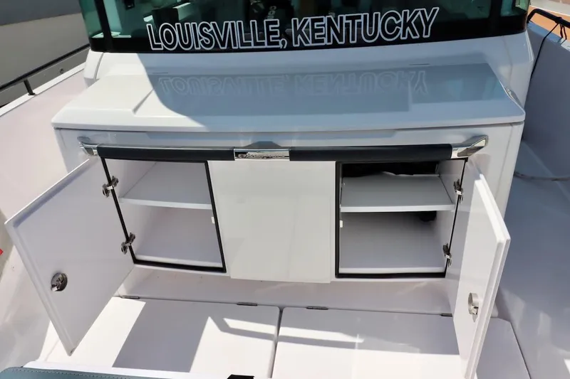 Slide: The Image of 2022 Axopar 37 XC Cross Cabin boat with open storage compartments, Louisville, Kentucky. - 45