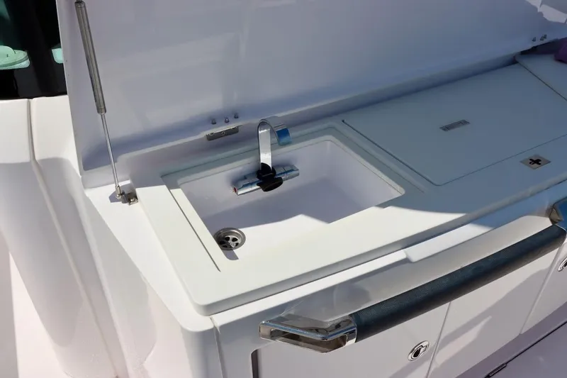 Slide: The Image of 2022 Axopar 37 XC Cross Cabin boat sink and countertop detail. - 47