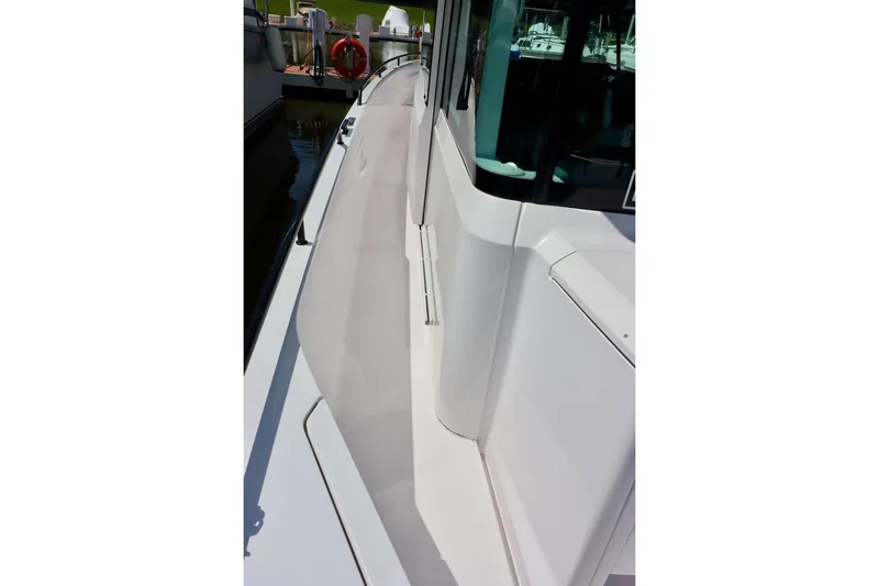 Slide: The Image of 2022 Axopar 37 XC Cross Cabin boat deck, showcasing sleek design and modern features. - 51