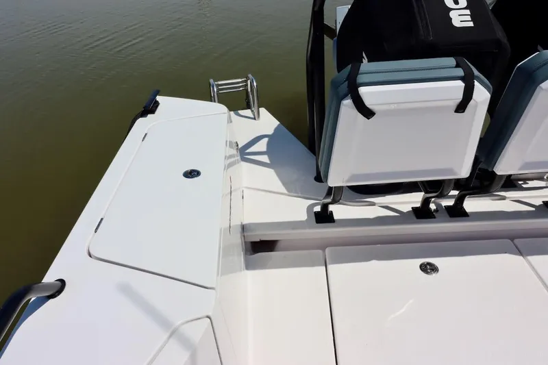 Slide: The Image of 2022 Axopar 37 XC Cross Cabin boat interior with seating and storage compartments. - 54