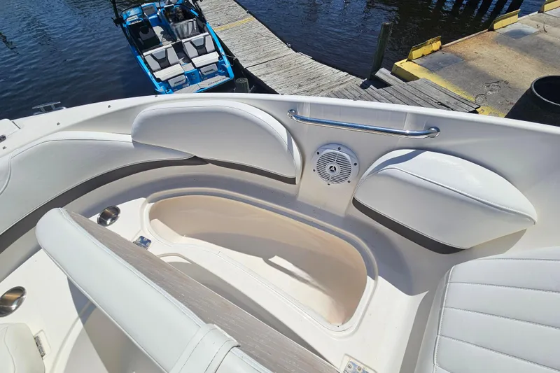Slide: The Image of Interior view of a 2006 Regal 2400 Bowrider boat at dock. - 11
