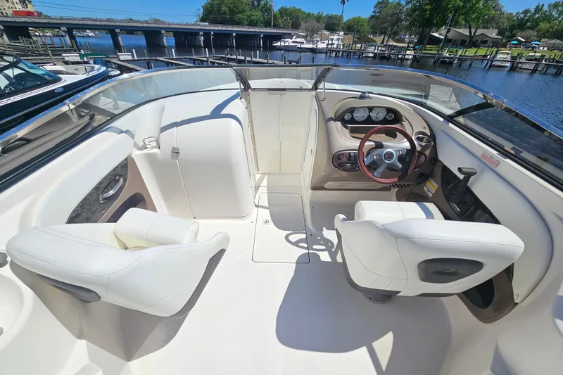 Slide: The Image of Interior of a 2006 Regal 2400 Bowrider boat at the dock. - 12