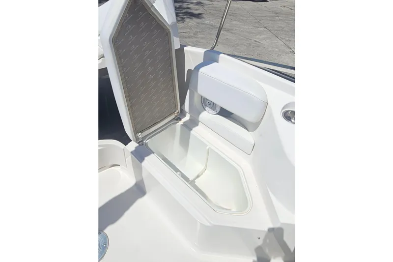 Slide: The Image of Regal 2400 Bowrider 2006, open storage compartment on boat. - 16