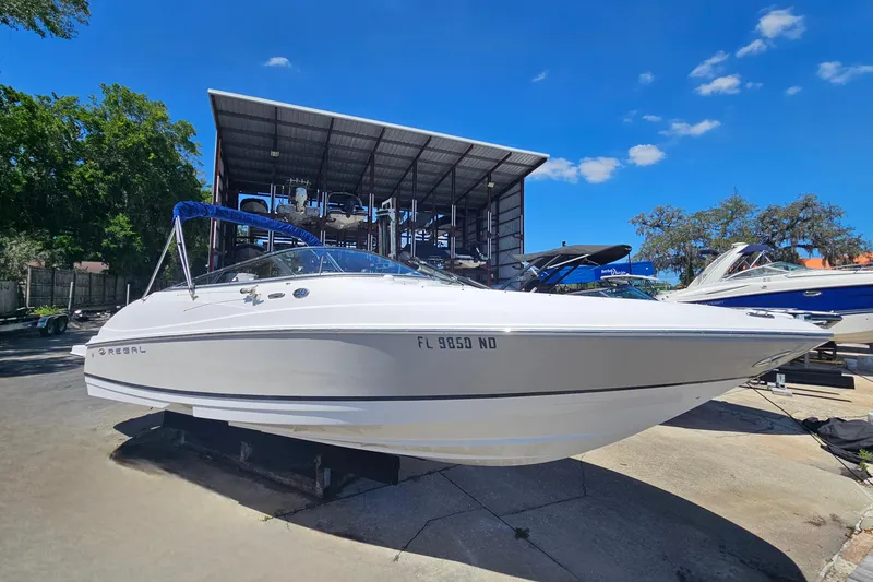 Slide: The Image of 2006 Regal 2400 Bowrider boat on a dry dock. - 5