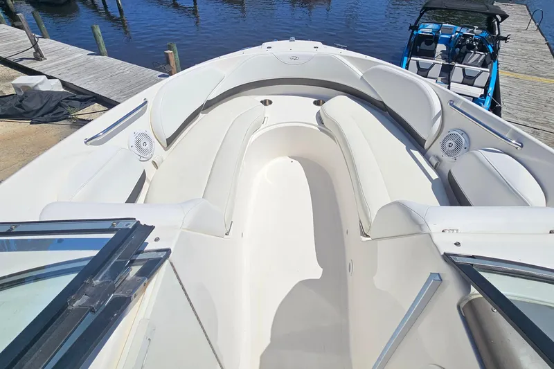 Slide: The Image of 2006 Regal 2400 Bowrider boat with spacious bow area at the dock. - 9