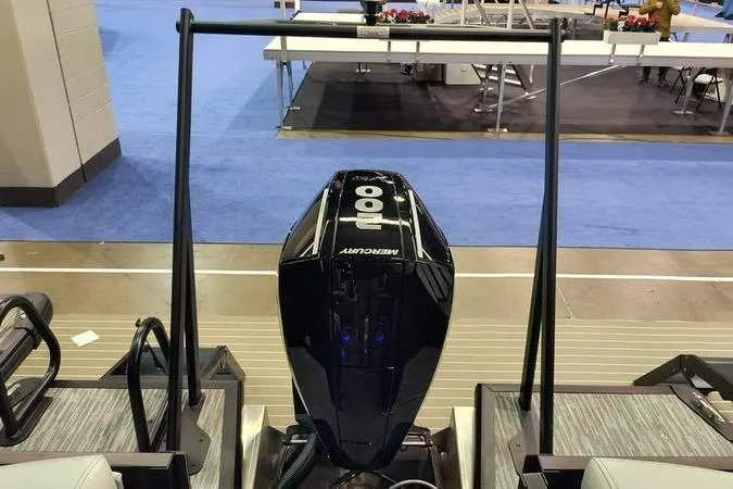 Slide: The Image of Viaggio X22Q 2026 with Mercury outboard motor on exhibition floor. - 3