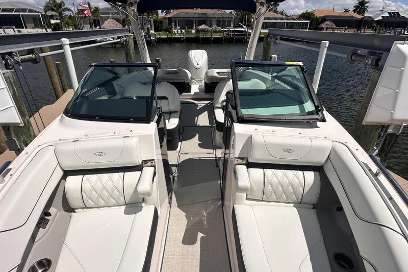 Slide: The Image of Interior of 2025 Regal LX6 boat with luxurious white seating. - 11