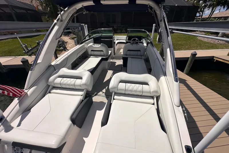 Slide: The Image of Interior of 2025 Regal LX6 boat with luxurious white seating. - 12