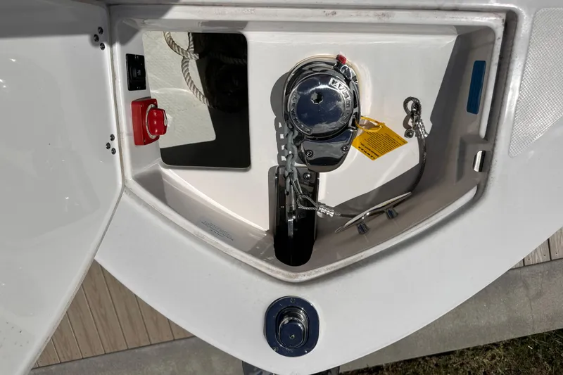 Slide: The Image of Anchor compartment of 2025 Regal LX6 with winch and rope. - 16