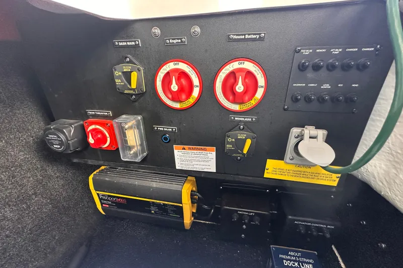 Slide: The Image of Regal LX6 2025 boat control panel with switches and charger. - 19