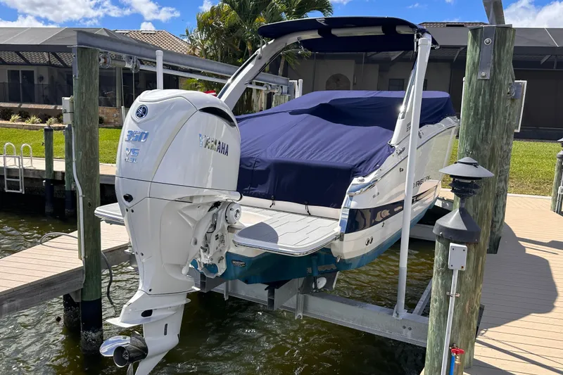 Slide: The Image of 2025 Regal LX6 boat with Yamaha engine at dock. - 3