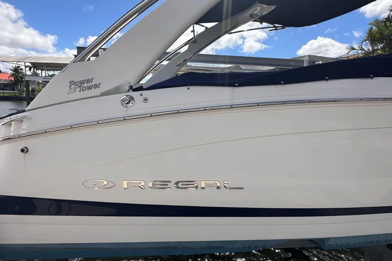 Slide: The Image of 2025 Regal LX6 boat with Power Tower on water. - 5