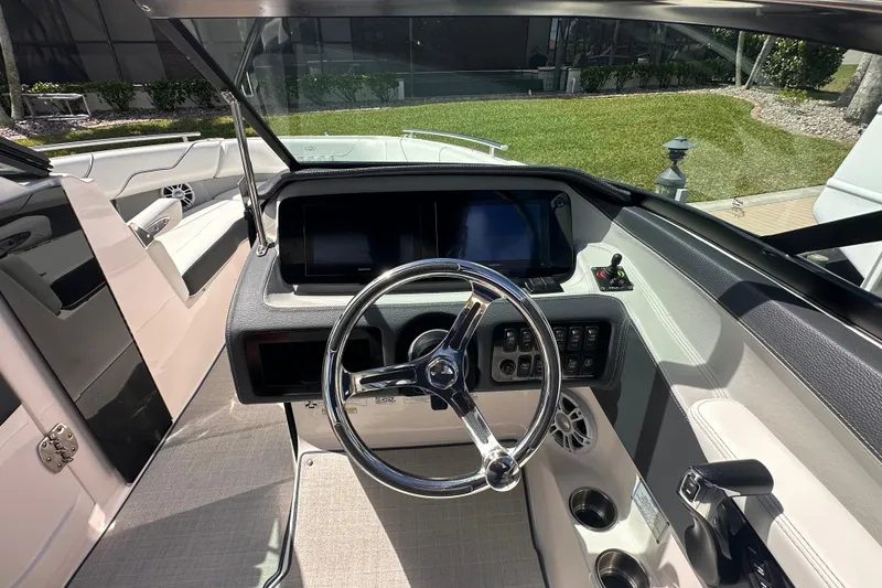 Slide: The Image of Interior view of 2025 Regal LX6 boat cockpit with modern controls. - 6