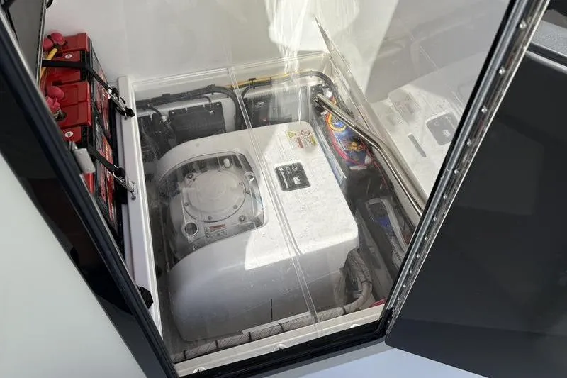 Slide: The Image of Engine compartment of a 2025 Stuart 27 boat. - 12