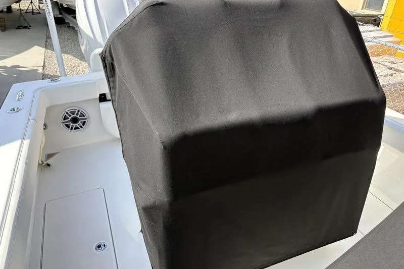 Slide: The Image of Covered helm station on a 2025 Stuart 27 boat. - 15