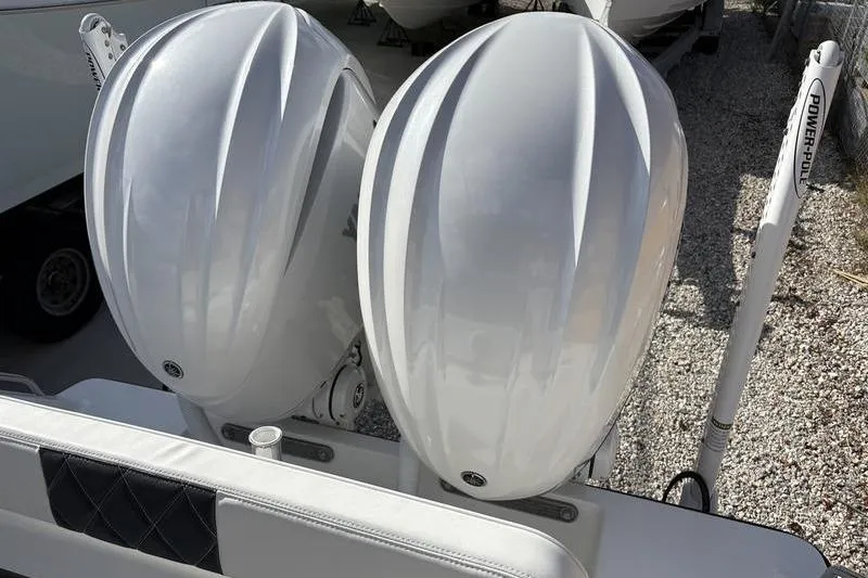 Slide: The Image of Dual outboard motors on a 2025 Stuart 27 boat. - 18