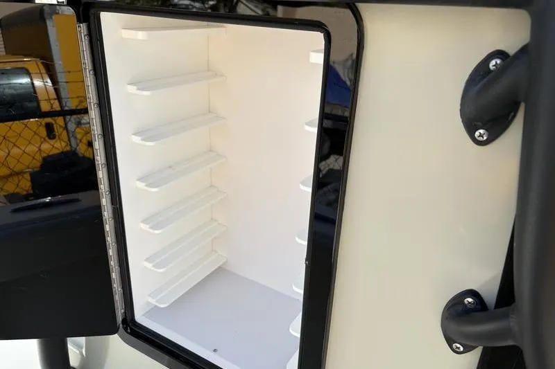 Slide: The Image of Open storage compartment in Stuart 27 boat, year 2025. - 19