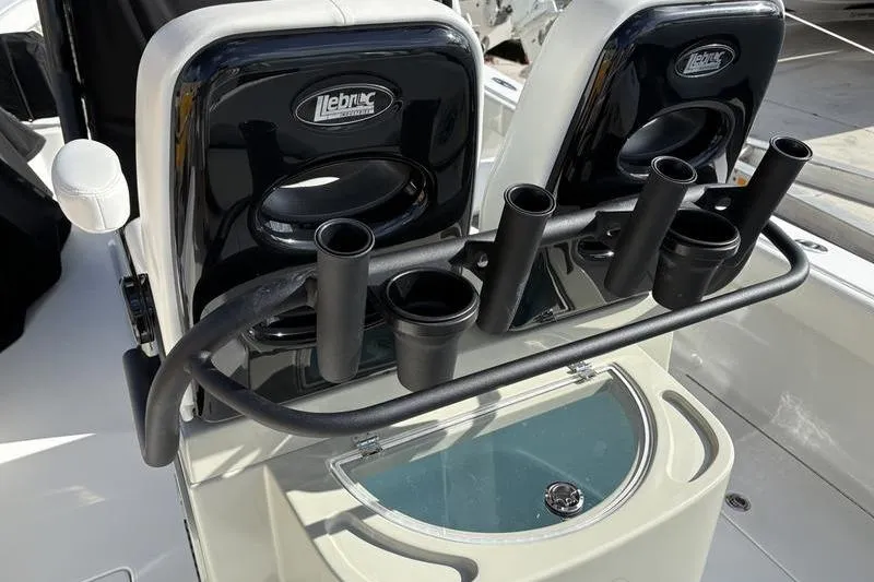 Slide: The Image of Stuart 27 boat 2025 with fishing rod holders and seat backrest. - 26