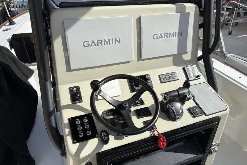 Slide: The Image of Stuart 27 boat helm with Garmin displays, 2025 model. - 27