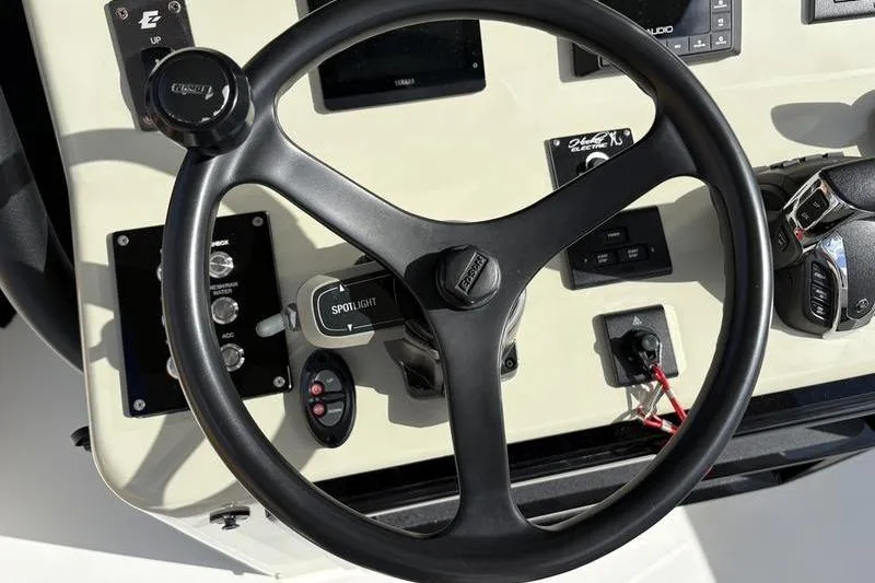 Slide: The Image of Steering console of a 2025 Stuart 27 boat. - 32