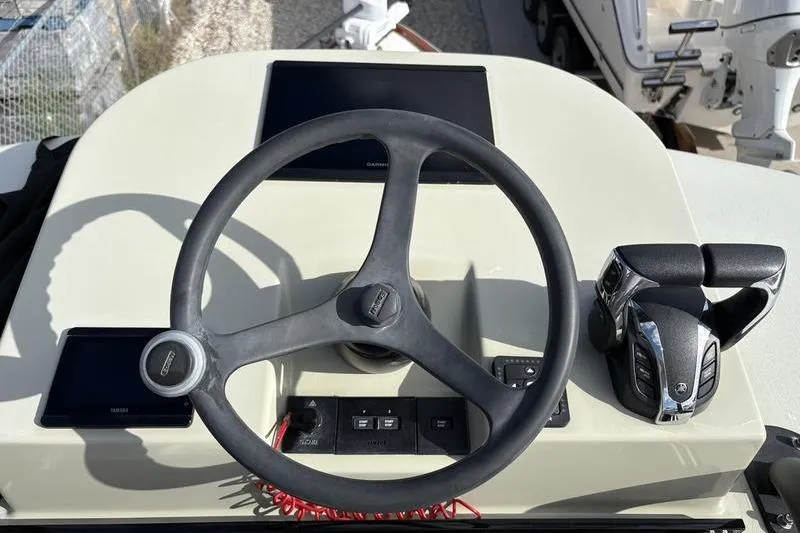 Slide: The Image of Steering console of a 2025 Stuart 27 boat. - 41