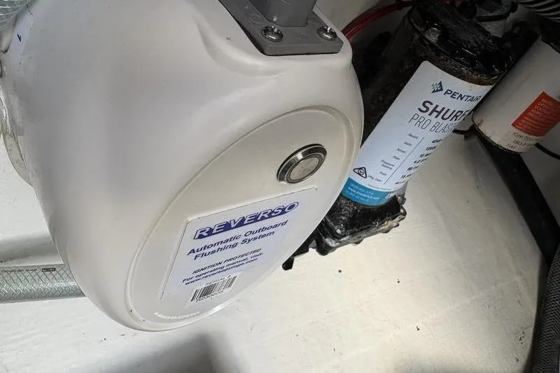 Slide: The Image of Reverso automatic outboard flushing system next to Shurflo pump. - 48