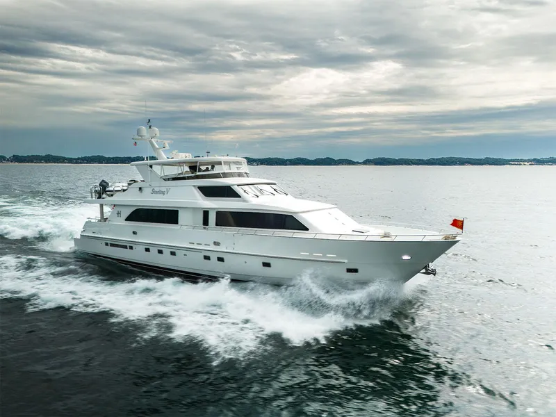 The Image of Luxury 2007 Hargrave 93' yacht cruising on open water under cloudy skies. - 0