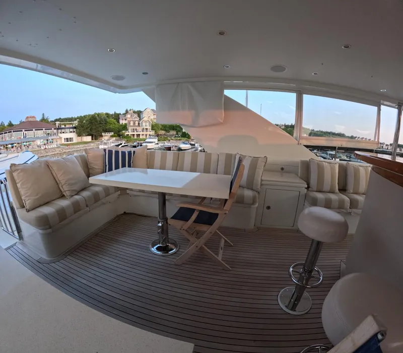 Slide: The Image of Luxurious 2007 Hargrave yacht interior with elegant seating and scenic marina view. - 17